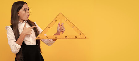 algebra and geometry. kid glasses study math. angle degree measurement. Banner of school girl student. Schoolgirl pupil portrait with copy space.の写真素材