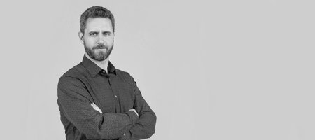 You can always be confident. Confident man keep arms crossed grey background. Casual style. Man face portrait, banner with copy space.の写真素材
