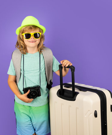 Kid on travel, isolated studio portrait. Child travel and adventure concept.の写真素材