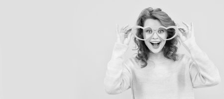 Woman isolated face portrait, banner with copy space. oh my god. just having fun. funny girl wear big glasses. birthday party. express happiness.の写真素材