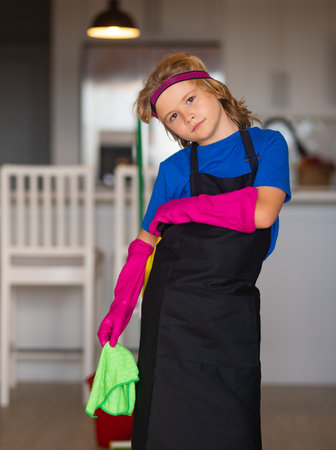Child mopping house, cleaning home. Detergents and cleaning accessories. Cleaning service. Little boy housekeeping.の写真素材