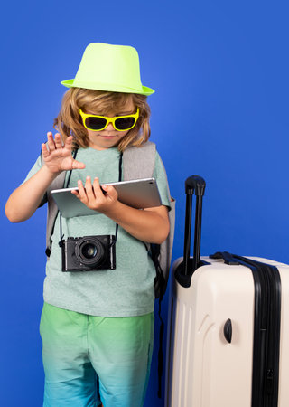 Kid on travel, isolated studio portrait. Child travel and adventure concept.の写真素材