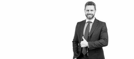 Achieving customer satisfaction for business success. Happy manager give thumbs up. Satisfaction. Man face portrait, banner with copy space. Business man in suit, isolated studio background.の写真素材