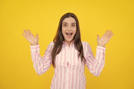 Surprised astonished young woman with open mouth. Portrait of excited amazed gasping girl. Expressive facial expressions.の写真素材