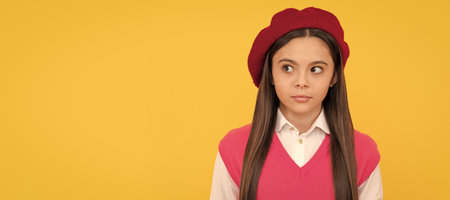kid looking away. serious kid in beret. child has long hair. skin beauty. tween and youth. Child face, horizontal poster, teenager girl isolated portrait, banner with copy space.の写真素材