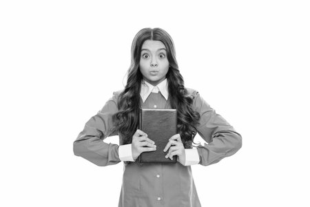 Playful kid hold school book isolated on white, bibliophileの写真素材