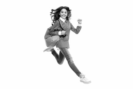 School teen with backpack. Teenager student, isolated background. Learning and knowledge. Go study. Run and jump. Education concept.の写真素材