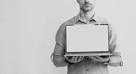 cropped man presenting webinar computer on yellow background, copy space, business presentation