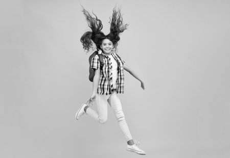 Amazed teen girl. Back to school. Teenage school girl ready to learn. School children on yellow...