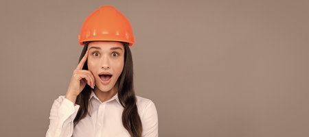 amazed inspired with idea architect woman in safety hardhat and white shirt, inspiration. Woman isolated face portrait, banner with mock up copy space.の写真素材