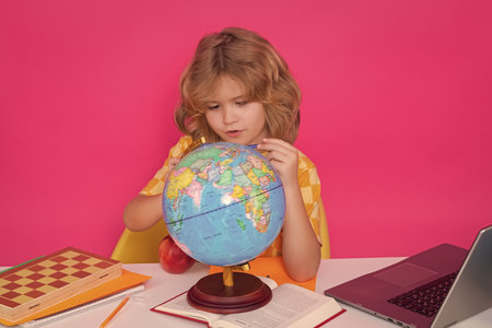 School and kids. Cute blonde child with a book learning. Knowledge day.の写真素材