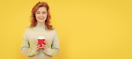 Woman isolated face portrait, banner with copy space. Enjoying hot drink. woman hold cup. good morning. express happiness. positive emotions. Woman with coffee cup.の写真素材