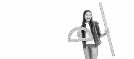 happy kid hold protractor ruler study geometry at school isolated on white, school. Horizontal isolated poster of school girl student. Banner header portrait of schoolgirl copy space.の写真素材