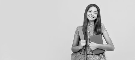 september 1. happy childhood. child with school bag. cheerful teen girl carry backpack. Banner of schoolgirl student. School child pupil portrait with copy space.の写真素材