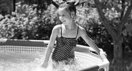 Summer chill time. Happy girl have fun in pool. Chill pool day. Summer vacationの写真素材