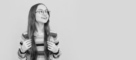 eye health. optical eyecare. back to school. knowledge and education. child long hair. Child face, horizontal poster, teenager girl isolated portrait, banner with copy space.の写真素材