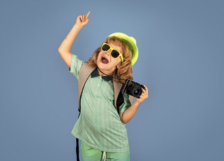Kid photographer with camera on travel . Children travel concept.の写真素材