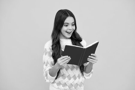 Back to school. Portrait of teenage school girl with books. Children school and education concept. Schoolgirl student.の写真素材