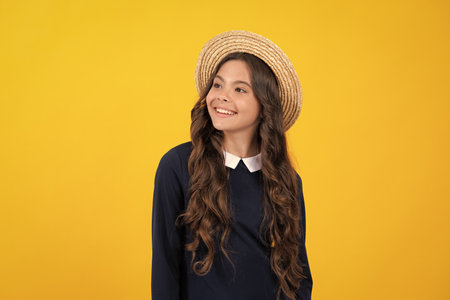 Cute young teenager girl against a isolated background. Studio portrait of pretty beautiful child.の写真素材