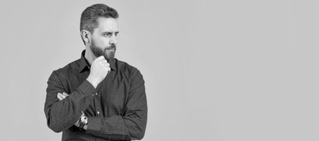 Man face portrait, banner with copy space. Unshaven man with stylish beard hair shape look serious...