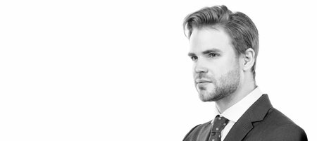 Be calm and focus on your work. Handsome man face. Portrait of professional man. Man face portrait, banner with copy space. Business man in suit, isolated studio background.の写真素材