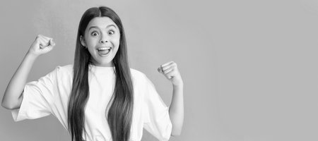 express positive emotions. pure success. Child face, horizontal poster, teenager girl isolated portrait, banner with copy space.の写真素材
