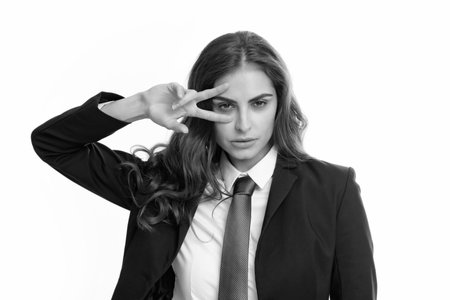 Business woman with victory sign. Happy positive funny businesswoman show victory v-sign gesture isolated on white background, studio portrait. Portrait of attractive funny crazy student.の写真素材