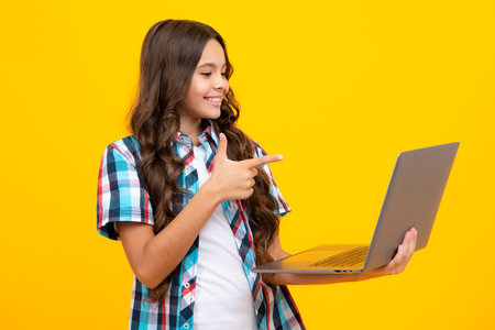 Young student school girl, studying with laptop computer. E-learning concept.の写真素材