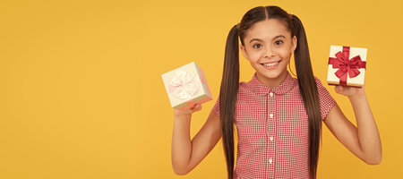 Nice purchase. shopping final sell out. teenage shopper. cheerful teen girl with gift boxes. Kid girl with gift, horizontal poster. Banner header with copy space.の写真素材