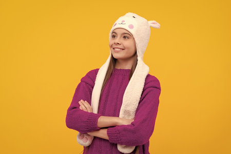 express positive emotion. glad child in earflap hat. kid wear warm clothesの写真素材
