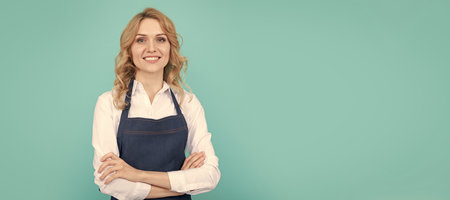happy woman barista in cook apron, housewife. Woman isolated face portrait, banner with mock up copy space.の写真素材