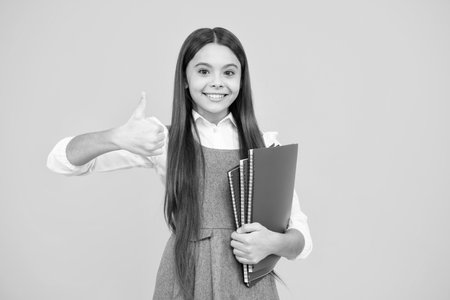 Teenager school girl study with books. Learning knowledge and kids education concept.の写真素材