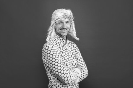 male winter fashion. mens beauty. mature guy portrait. smiling man in earflap hat.の写真素材