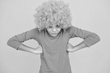 Close up portrait of the cute clown girl. Angry face, upset emotions of teenager girl.の写真素材