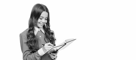 Learn to write. Happy child do homework in writing. Calligraphic writing and calligraphy. Banner of schoolgirl student. School child pupil portrait with copy space.の写真素材
