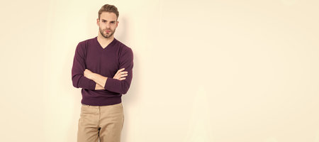 Be comfortable yet stylish. Handsome man keep arms crossed. Comfortable is essential. Man face portrait, banner with copy space.の写真素材