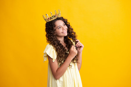 Beauty teen girl queen wear crown. Child in princess diadem. Happy teenager, positive and smiling emotions of teen girl.の写真素材