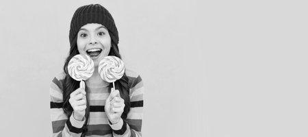 wow. happy teen girl hold lollipop. lollipop lady. hipster kid with colorful lollypop sugar candy....