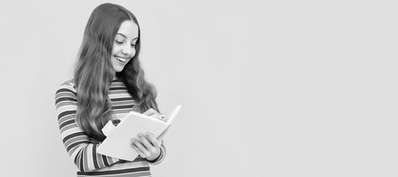 Keep calm and do your hometask. Happy child do homework assignment. Homework writing. Horizontal isolated poster of school girl student. Banner header portrait of schoolgirl copy space.の写真素材