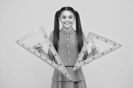 Back to school. Teenager school girl on isolated background. School supplies. Happy teenager, positive and smiling emotions of teen schoolgirl.の写真素材