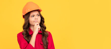 Renovation child, protection and safety. kid education concept. on construction site. improve your childhood. Child builder in helmet horizontal poster design. Banner header, copy space.の写真素材