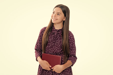 Back to school. Portrait of teenage school girl with books. Children school and education concept. Schoolgirl student. Portrait of happy smiling teenage child girl.の写真素材