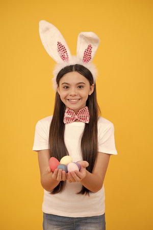 So happy. happy easter. childhood happiness. child in rabbit ears and bow tie. time for fun.の写真素材