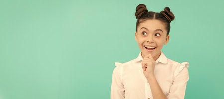 She is very imaginative. Imaginative child blue background. Active imagination. Basic education. Child face, horizontal poster, teenager girl isolated portrait, banner with copy space.の写真素材