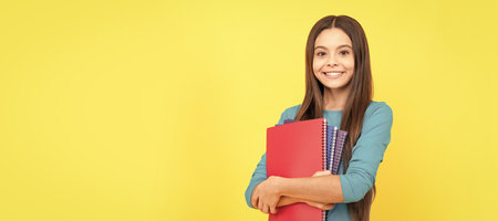 Towards knowledge. back to school. Portrait of schoolgirl student, banner header. School child face isolated panorama background with copy space.の写真素材