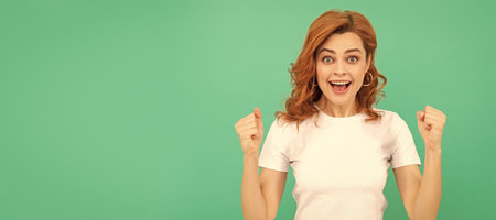 Woman isolated face portrait, banner with copy space. happiness. happy woman with curly hair celebrating success. beauty and fashion.の写真素材