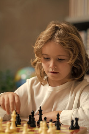 Chess school. Child think or plan about chess game in classroom. Intelligent, smart and clever school kids.の写真素材