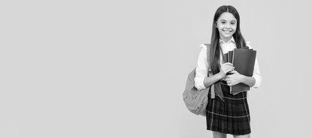 schoolgirl with notepad and backpack. back to school. teen girl ready to study. Horizontal isolated poster of school girl student. Banner header portrait of schoolgirl copy space.の写真素材