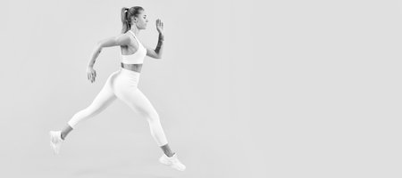sport woman runner running. Woman jumping running banner with mock up copyspace.の写真素材