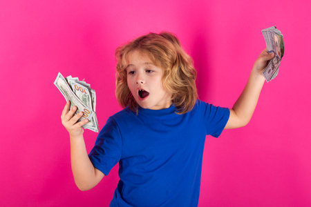 Money bills, salary payment. Rich kid with dollars. Lottery cashback, win big money isolated pink red background.の写真素材